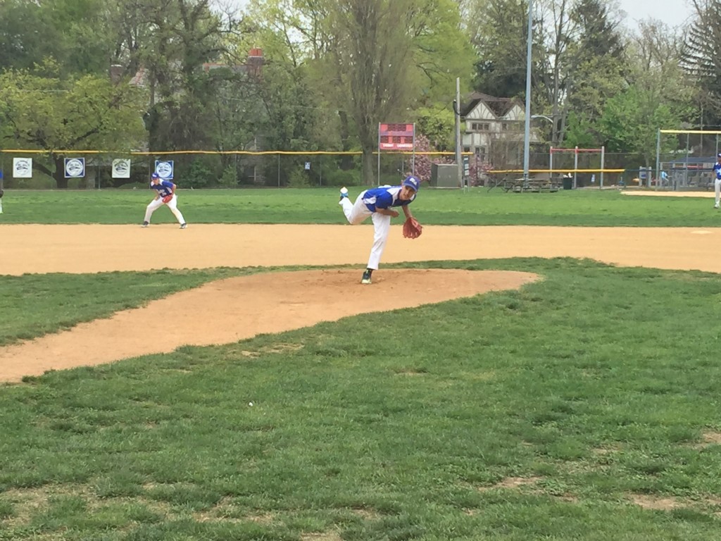 Lukas Aznar pitches in the 1st inning against E&M